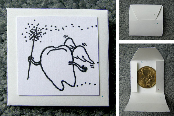 Coin carrier: Handmade scrapbook-paper envelope with a winged-tooth cartoon